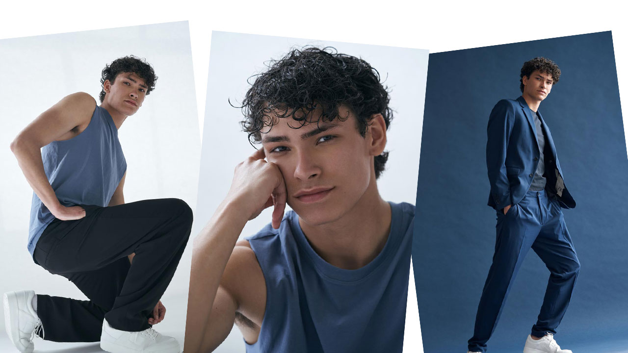 blogpost-model-dutch-netherlands-blue-suit-background-top-shirt-black-pants-curls-curly-hair